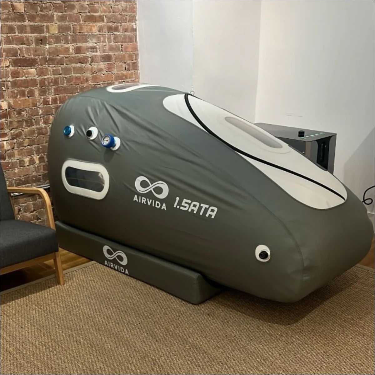 An Airvida 1.5ATA hyperbaric oxygen therapy chamber in a room.