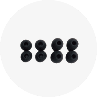 Set of six black earbud tips on a white background