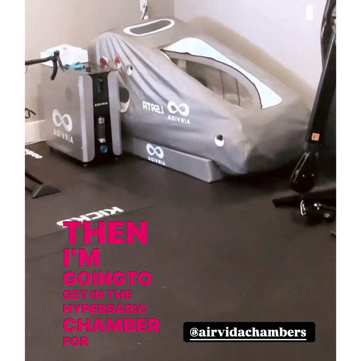 An Airvida 1.5ATA hyperbaric chamber sits on a gym floor.