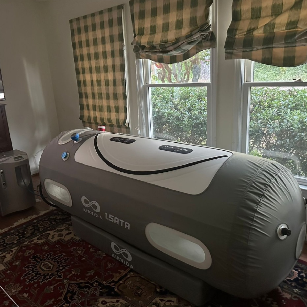 Airvida 1.5 ATA soft hyperbaric chamber set up in home therapy room