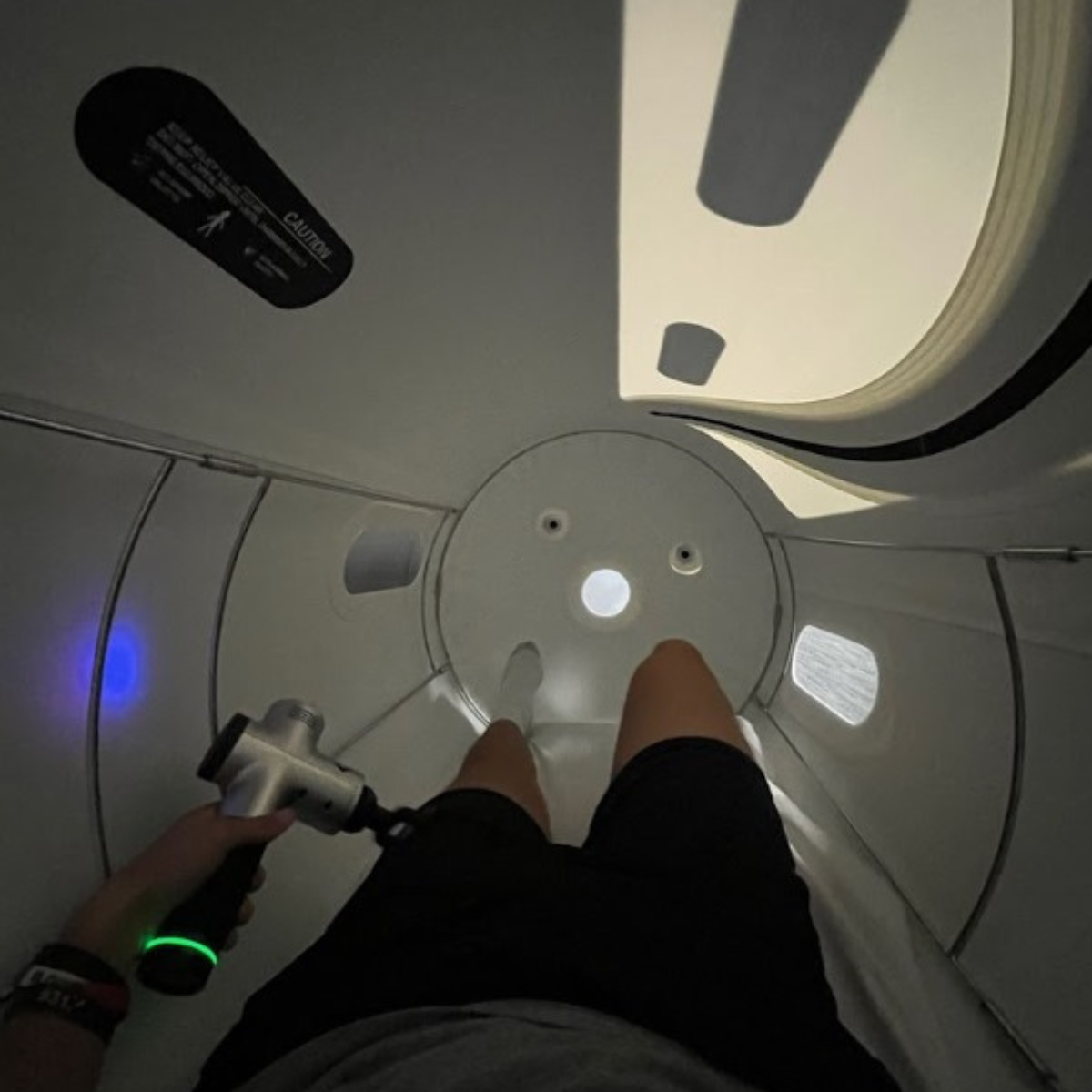 A person is seen from the feet up inside the 1.5 hyperbaric chamber.
