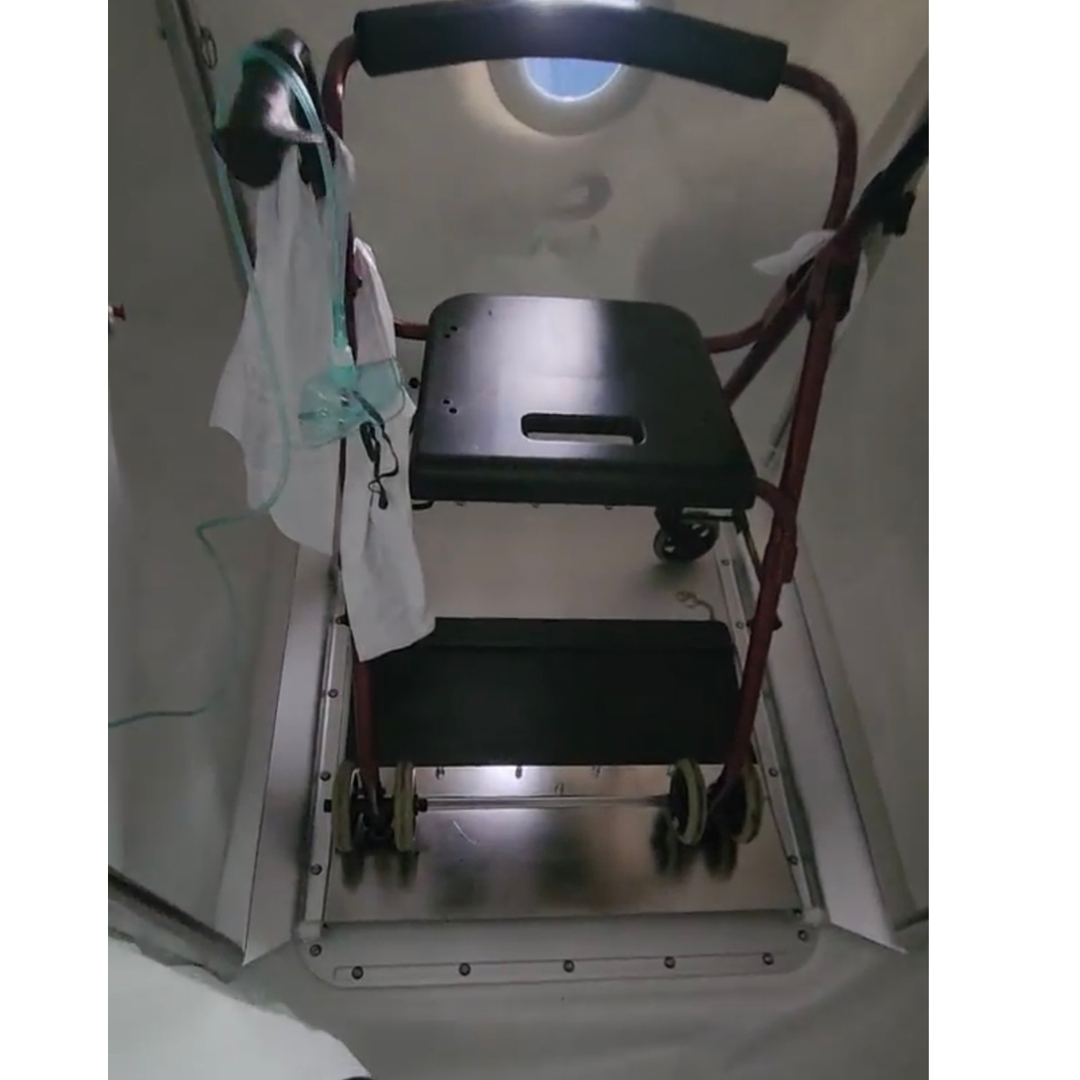 Walker inside Airvida soft hyperbaric chamber for assisted HBOT therapy