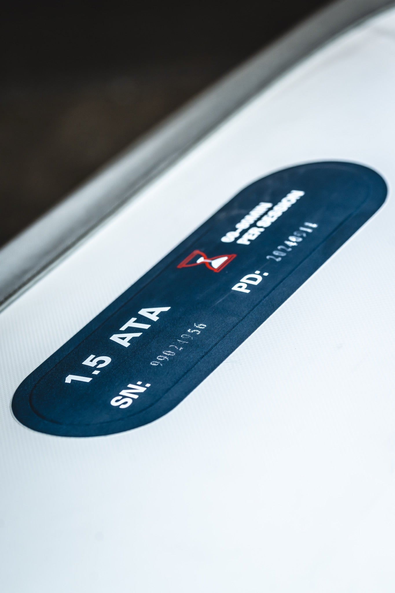 Close-up of a 1.5 ATA pressure rating label on an AIRVIDA hyperbaric chamber, displaying serial and product identification details.